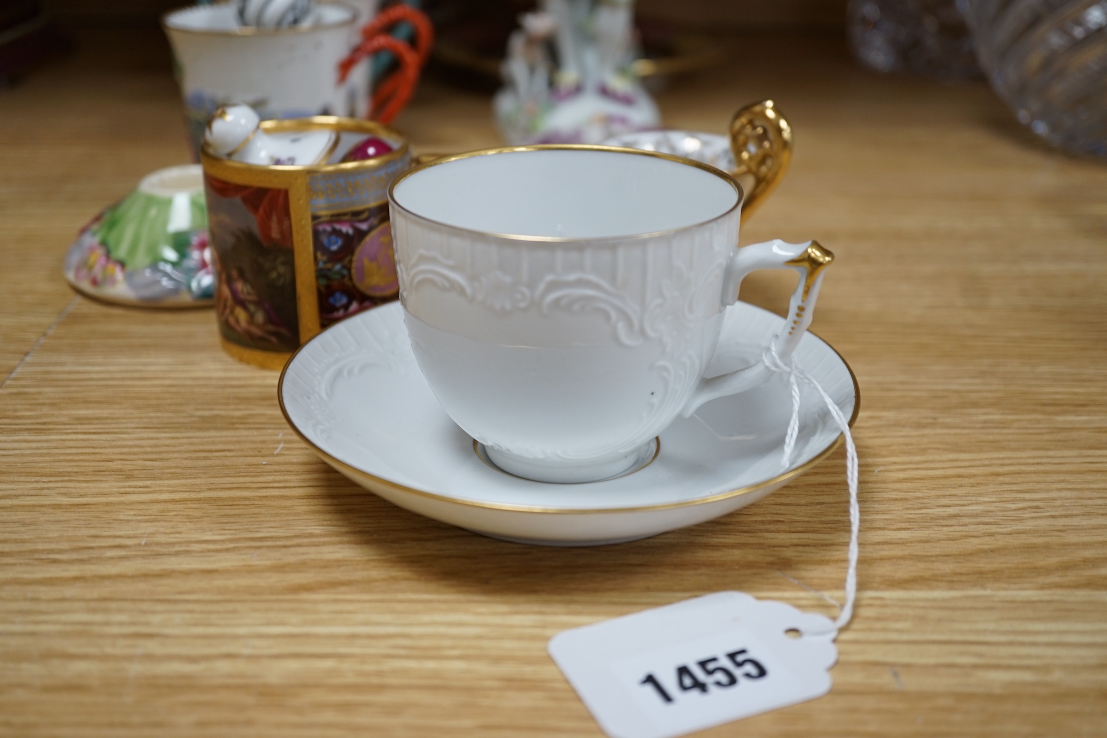 19th century Continental tableware, including Richard Ginori Capodimonte style cups and a porcelain figure group of a gentleman and dog, largest 25cm high